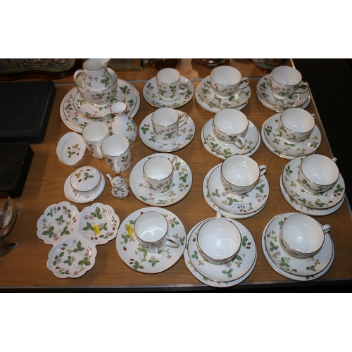 412 - Wedgwood Wild Strawberry part tea and coffee set to include cups and saucers, a milk jug, etc.