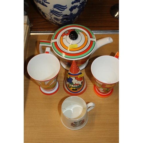 416 - Art Deco Bizarre ware inspired by Clarice Cliff to include a teapot, a sugar castor, etc.