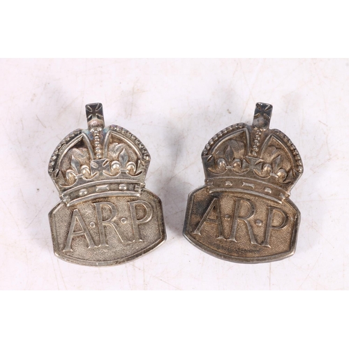 482 - Two silver Air Raid Precautions ARP badges.