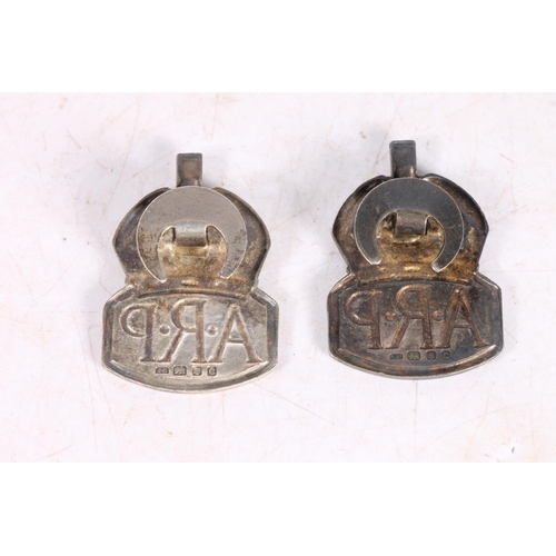 482 - Two silver Air Raid Precautions ARP badges.