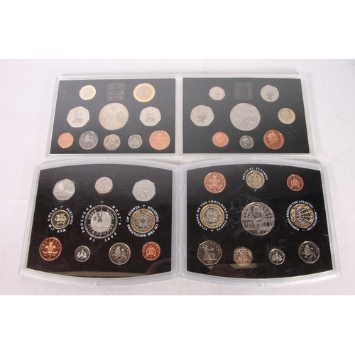 493 - Four British proof coin year sets to include 1993, 1997, 2000 and 2001.