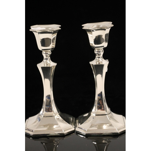 601 - George V Art Deco weighted silver candlesticks of geometric faceted form, James Deakin & Sons, B... 