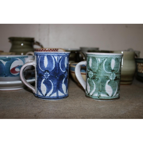 389 - Studio pottery in the manner of Alan Caiger Smith to include four soup coupes, saucers and a bowl si... 