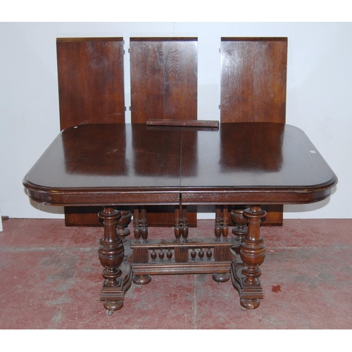 441 - Antique-style oak extending dining table with three additional leaves, on central balustrade column ... 