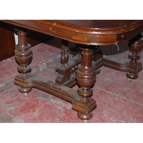 441 - Antique-style oak extending dining table with three additional leaves, on central balustrade column ... 