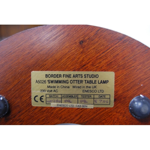 212 - Border Fine Arts Studio table lamp designed by Adrian Hughes, c. 2004, in the form of a swimming ott... 