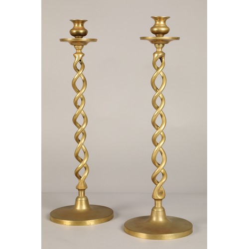 253 - Pair of Barley twist brass candlesticks, 47.5cm high.