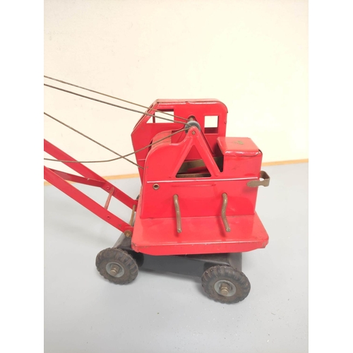 138 - Triang. Vintage tinplate KL 44 model Jones Mobile Crane. Red body, with black base and litho-printed... 