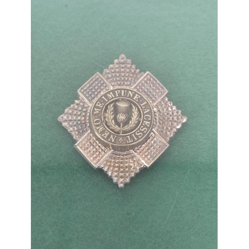 360 - Framed collection of British military cap badges mostly Victorian and WW1 and relating to Scottish r... 