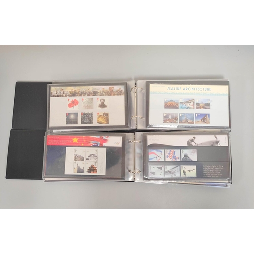 402 - Two albums of c2000s British mint presentation packs postage stamp sets comprising of 215 first clas... 