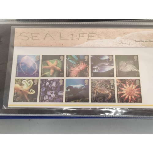 403 - Two albums of c2000s British mint presentation packs postage stamp sets comprising of 122 first clas... 