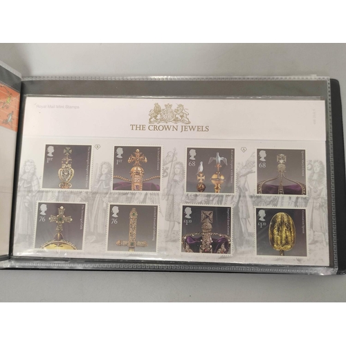 403 - Two albums of c2000s British mint presentation packs postage stamp sets comprising of 122 first clas... 