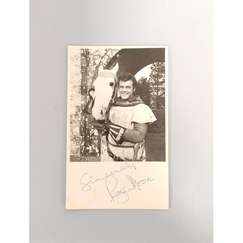 477 - Roger Moore signed cinema promo card 13.5cm x 8.3cm 