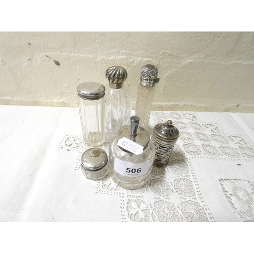 506 - Six silver topped perfume bottles and pots etc.