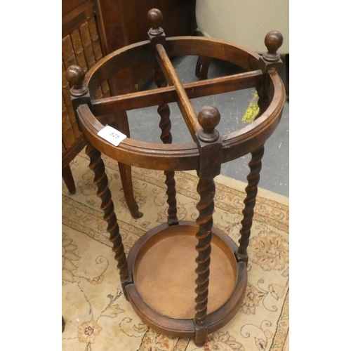 525 - Antique oak barley twist circular stick stand.