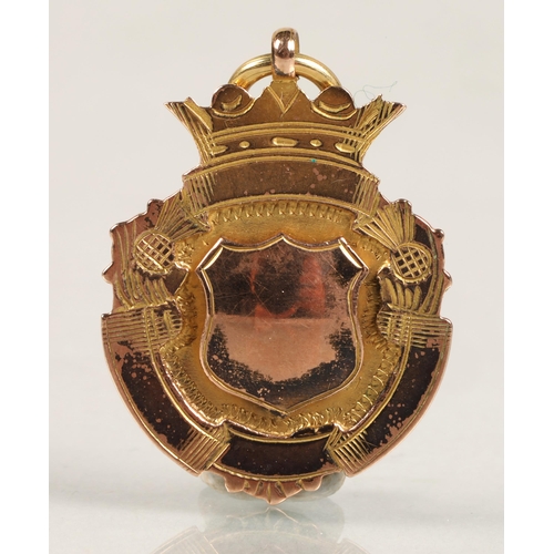 66 - 9ct rose gold badge inscribed 'New Milns School Championship won by Hugh M. Young 1923', 4.3g