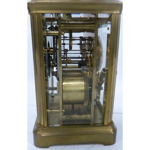 189 - Brass four glass carriage clock with movement viewing window to the top, 12cm high, with tooled case... 