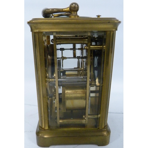 189 - Brass four glass carriage clock with movement viewing window to the top, 12cm high, with tooled case... 