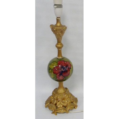 220 - Moorcroft 'Hibiscus' table lamp with spherical tube-lined column on green ground, 41cm high.