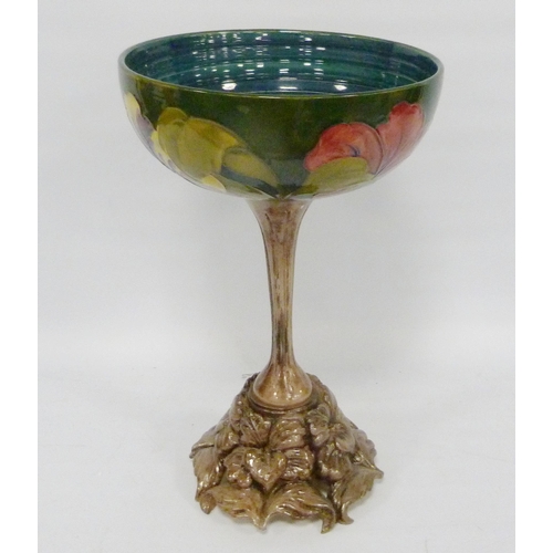 221 - Moorcroft 'Hibiscus' centrepiece bowl with tube-lined decoration on green ground, fixed to a resin b... 