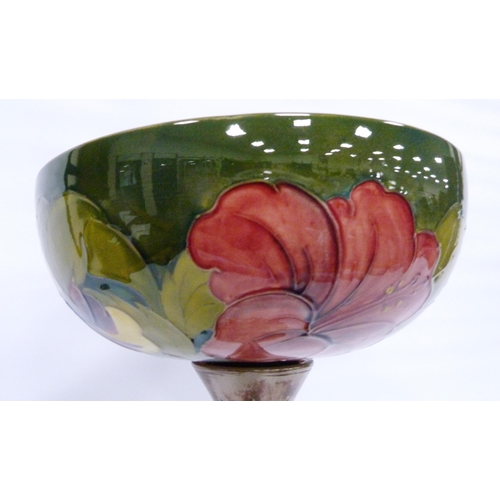 221 - Moorcroft 'Hibiscus' centrepiece bowl with tube-lined decoration on green ground, fixed to a resin b... 