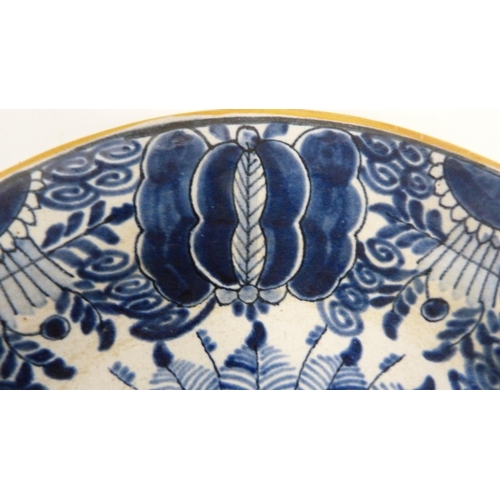 226 - 18th century Delft blue and white pottery faience peacock plate, underglazed in blue on a white grou... 