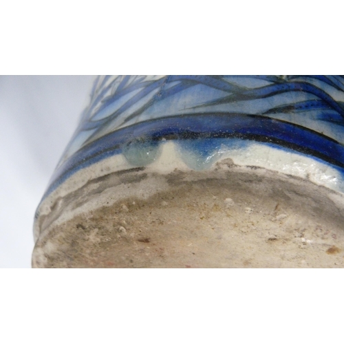 211 - Persian Iznik ovoid pottery vase, probably late 19th century, of large proportions, under glazed wit... 