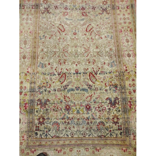 413 - Persian hand-knotted rug with multiple trailing foliate patterns and guard stripes, on cream ground ... 