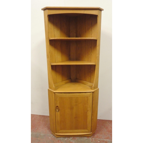 450 - Ercol blonde elm Windsor corner unit with open shelving above a cupboard door, enclosing a shelved i... 