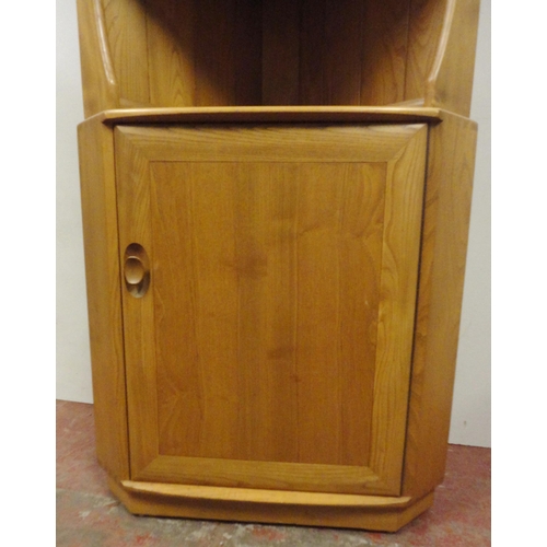 450 - Ercol blonde elm Windsor corner unit with open shelving above a cupboard door, enclosing a shelved i... 