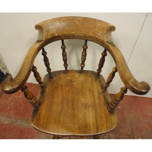 454 - Victorian ash and elm bow-back smoker's or captain's chair, with turned spindle columns and solid se... 