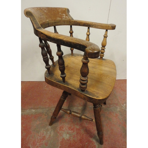 454 - Victorian ash and elm bow-back smoker's or captain's chair, with turned spindle columns and solid se... 