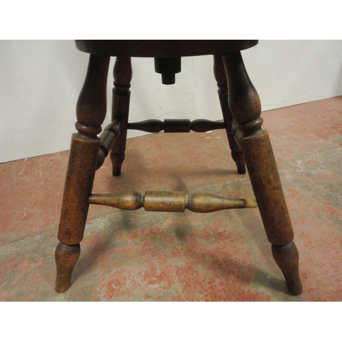 454 - Victorian ash and elm bow-back smoker's or captain's chair, with turned spindle columns and solid se... 