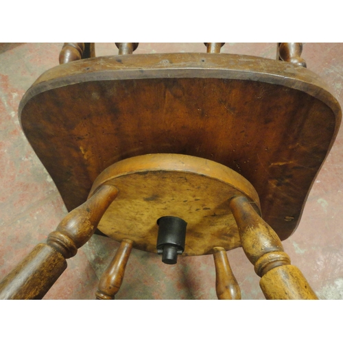 454 - Victorian ash and elm bow-back smoker's or captain's chair, with turned spindle columns and solid se... 