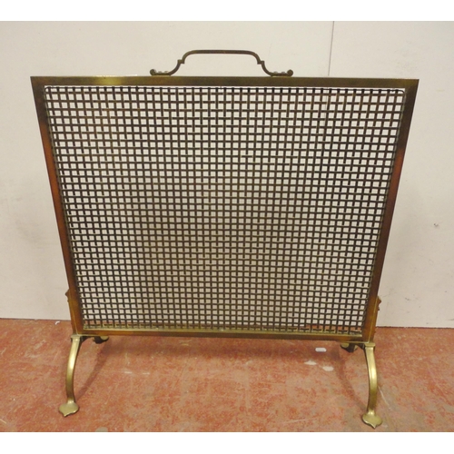 461 - Arts & Crafts brass fire screen with mesh protection screen, on splayed supports and stylised fe... 