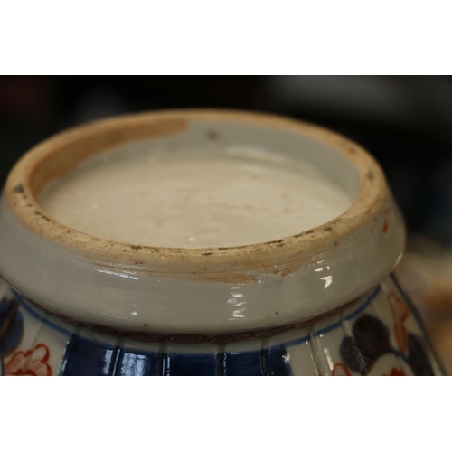 190 - Oriental pumpkin shaped baluster Imari temple jar and cover, 30cm high.