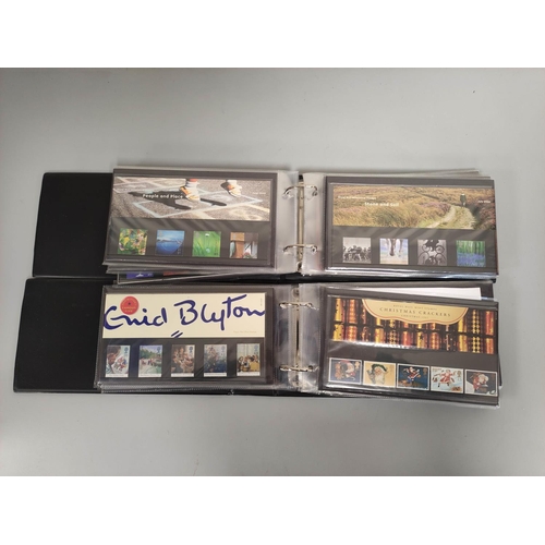 405 - Two albums of c1990s-2000s British mint presentation packs postage stamp sets comprising of 46 first... 