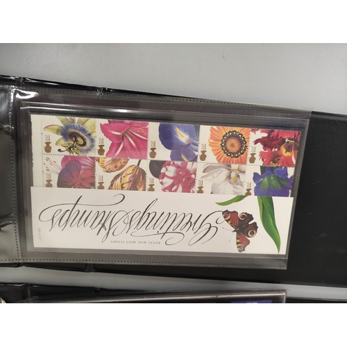 405 - Two albums of c1990s-2000s British mint presentation packs postage stamp sets comprising of 46 first... 