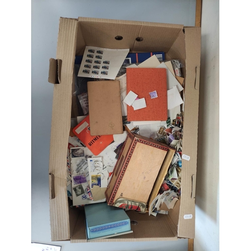 406 - Box containing a large quantity of mixed World postage stamps.