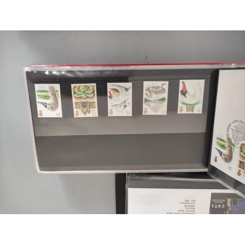 409 - Box containing a large quantity of presentation packs and first day covers dating from the 1960s-90s... 