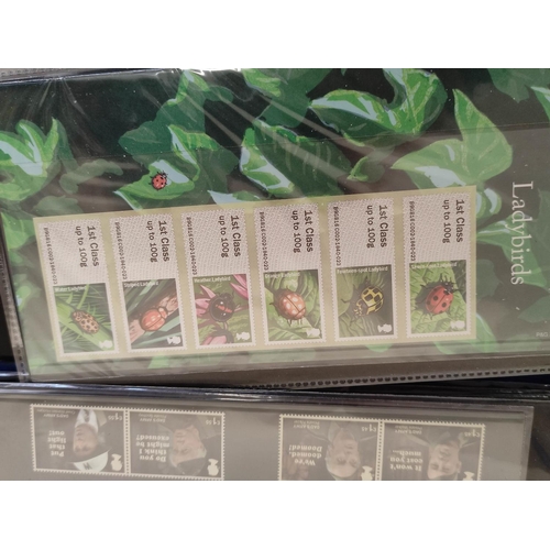 411 - Two albums of c2010s British mint presentation packs postage stamp sets comprising of 211 first clas... 