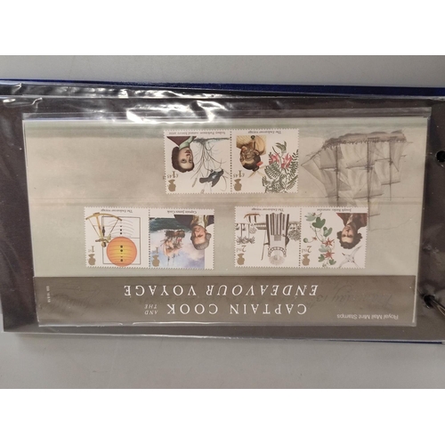 411 - Two albums of c2010s British mint presentation packs postage stamp sets comprising of 211 first clas... 