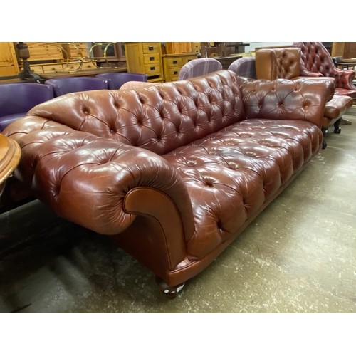 566 - Chesterfield-style three seater settee, approx. dimensions H 90cm, W 240cm, D 100cm