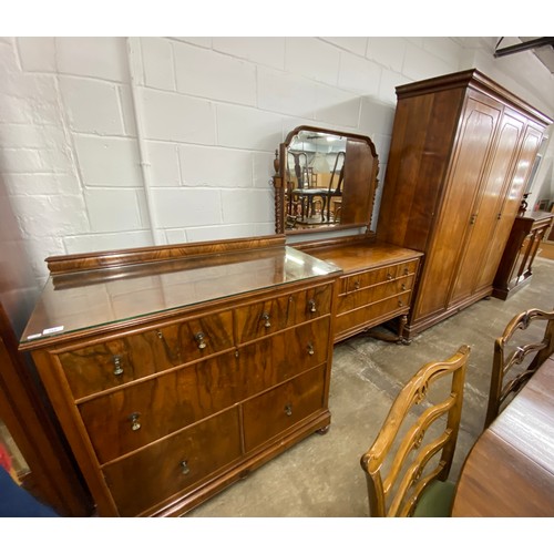 556 - Bedroom suite comprising chest of drawers, mirror back dressing table and large wardrobe