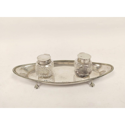 167 - Silver ink stand with two mounted glass receivers on oval base by Reids 1905. 174g weighable. 5.5oz.