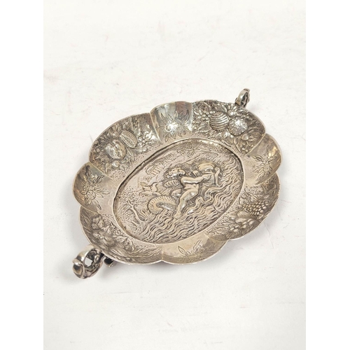 168 - Continental silver oval lobed dish with silver handles and embossed scene of a boy on a dolphin with... 