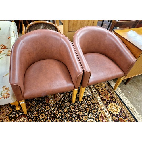 577 - Two contemporary brown leather chairs, approx. 75cm height