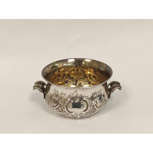 103 - Silver porringer embossed with scrolls, with similar handles by W.K Reid 1848, 191g, 6oz.