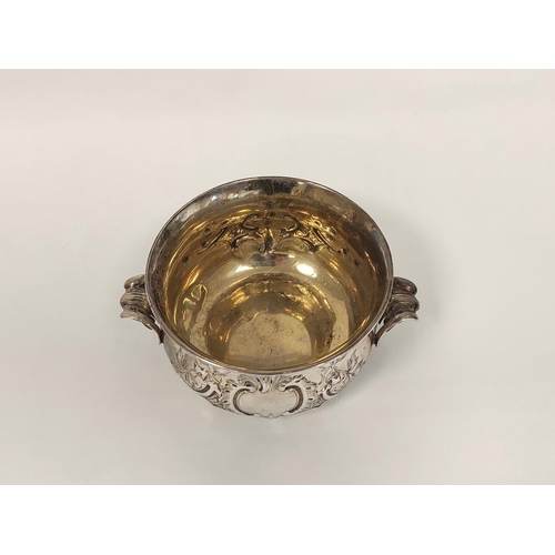 103 - Silver porringer embossed with scrolls, with similar handles by W.K Reid 1848, 191g, 6oz.