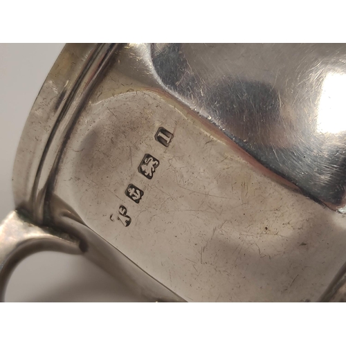 104 - Silver mug of panelled form and a similar sugar bowl. 312g